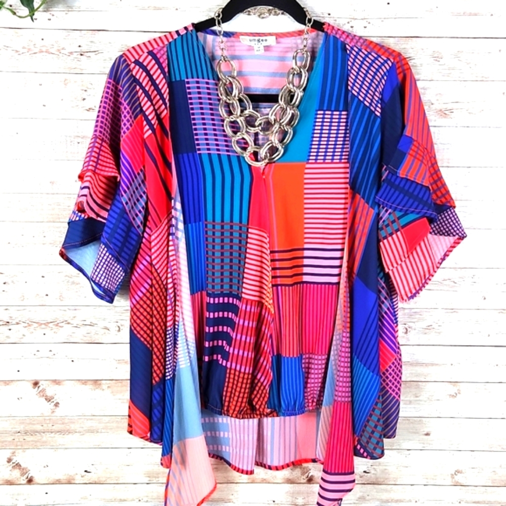 Umgee, women's multi colored block plaid faux layered top. Flair sleeves…